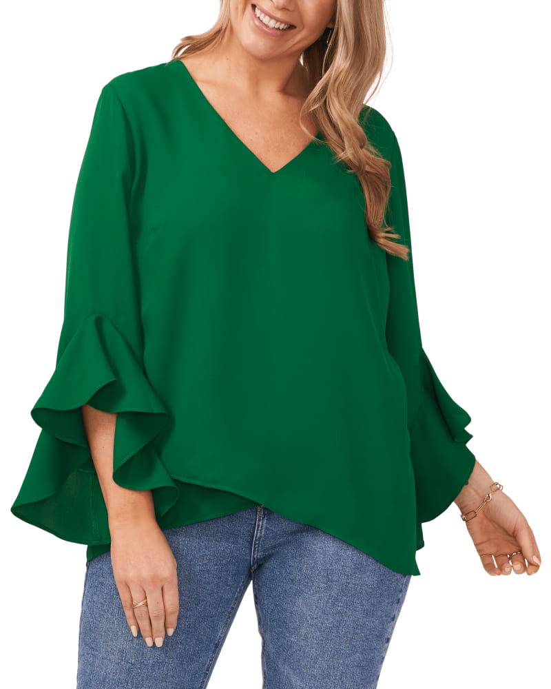 Front of a model wearing a size 0X Natalie Flutter Sleeve Tunic in Rich Meadow by Vince Camuto. | dia_product_style_image_id:261554